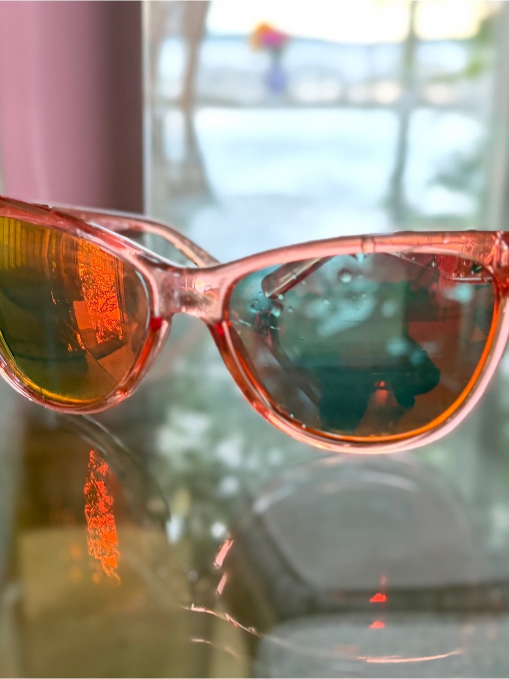 Oakley Pink Transparent Frame Sunglasses with Orange-Glow Lenses
